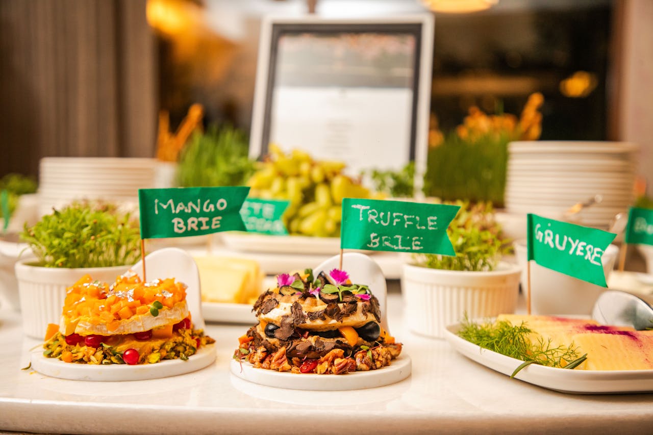 A delectable display of artisan cheeses topped with fresh ingredients at a gourmet event.